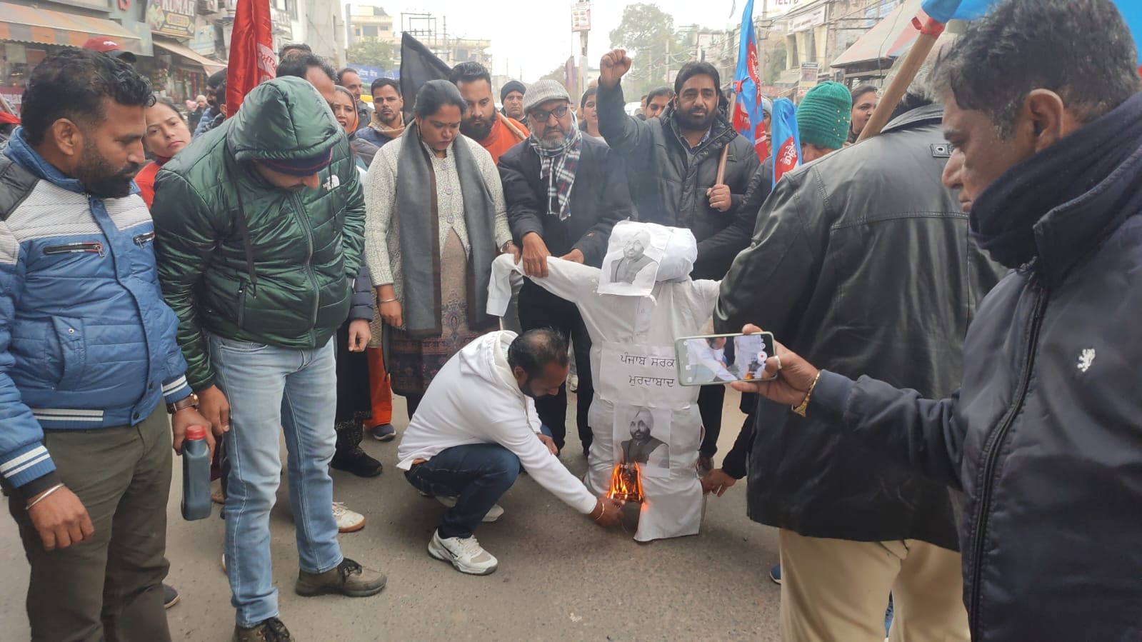Computer teachers from across the district staged a strong protest by burning the bier and jhoodi di pand of the state government